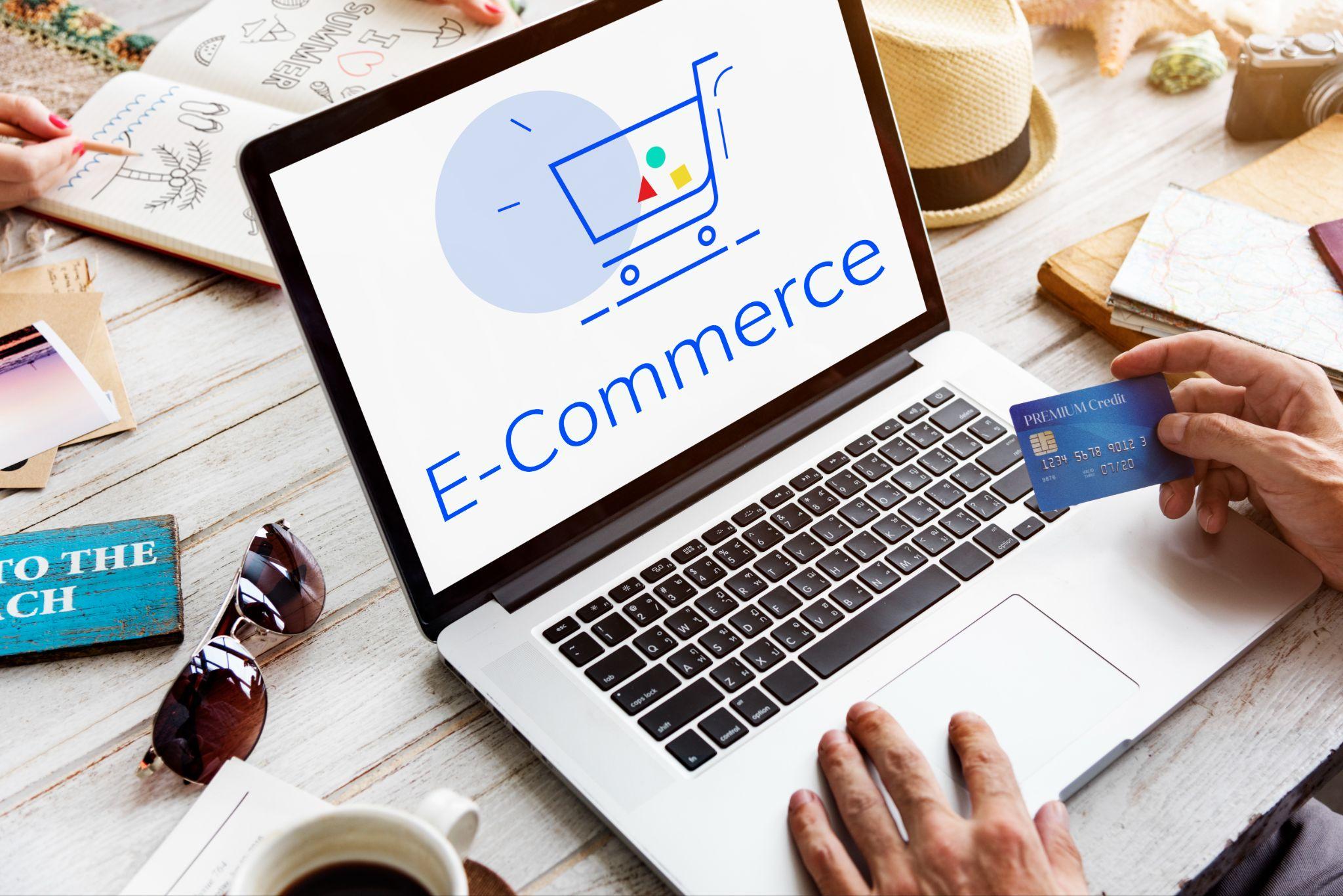 Laptop with e-commerce graphic and card for ecommerce SEO services