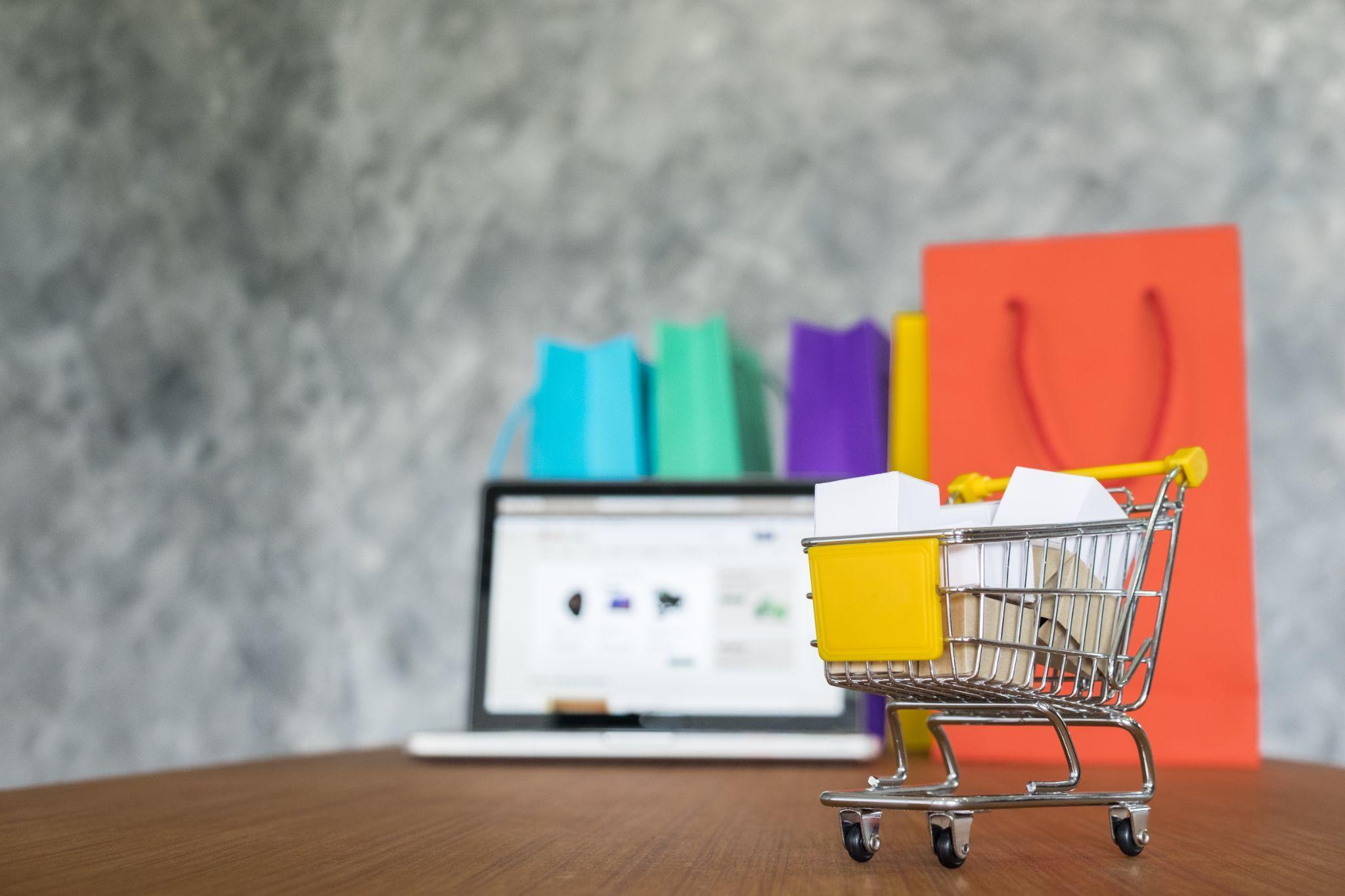 Mini shopping cart and bags representing ecommerce product discovery