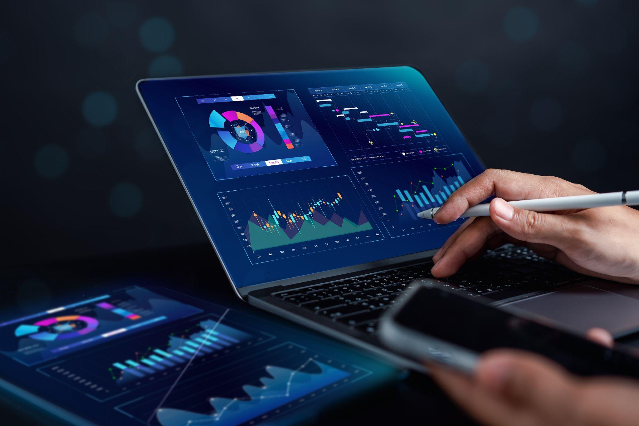 A person looking at a dashboard of business metrics on a laptop